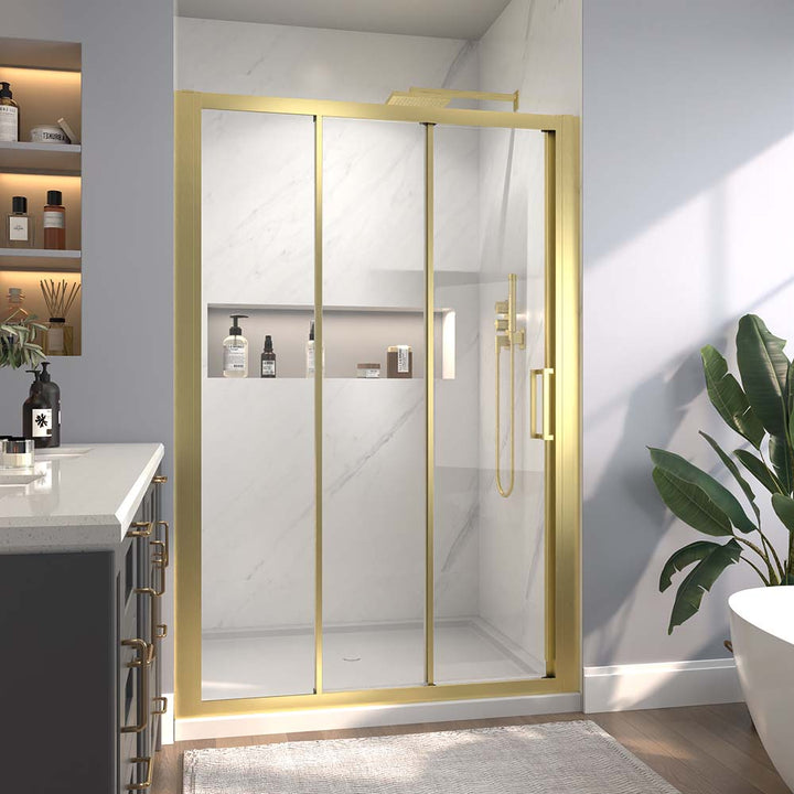 Gold-framed sliding shower door in modern bathroom with shelves