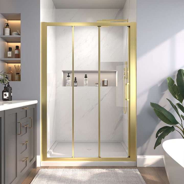 Gold-framed sliding shower door in modern bathroom with shelves