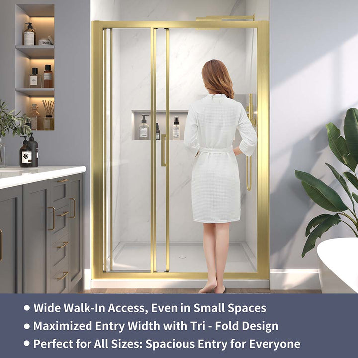 Gold-framed sliding shower door with wide walk-in access and tri-fold design