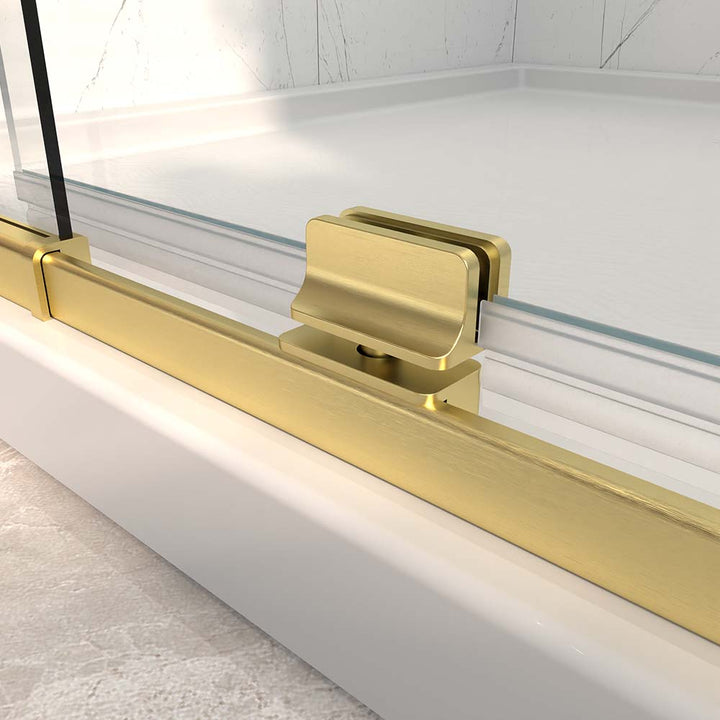 Gold shower door bottom hinge and pivot bracket detail view