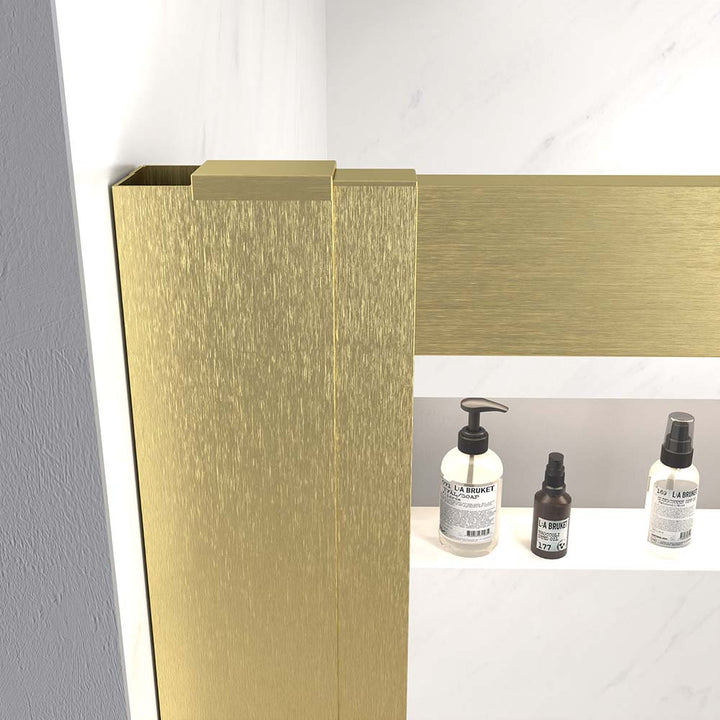 Close-up of the corner joint of a gold shower door
