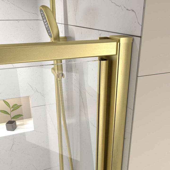 Gold shower door frame and hardware detail close up view