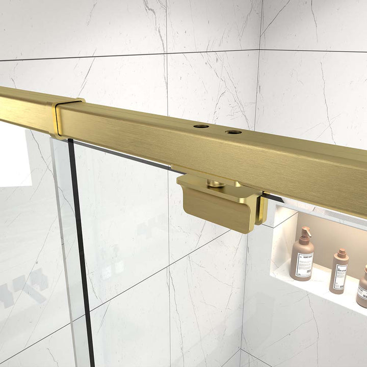 Gold shower door top guide rail and metal clamp detail view