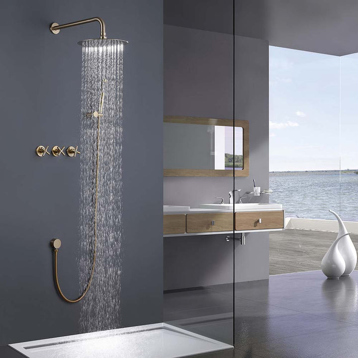 Gold shower system in use with water flow in modern bathroom