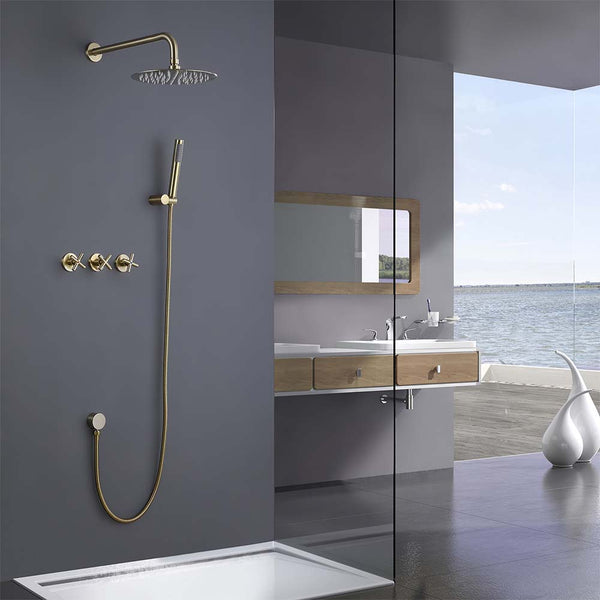 Gold shower system installed in modern ocean view bathroom