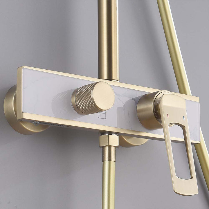 Close-up of gold shower system control valve and diverter handle