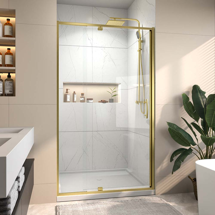 Modern gold sliding glass shower door in marble bathroom