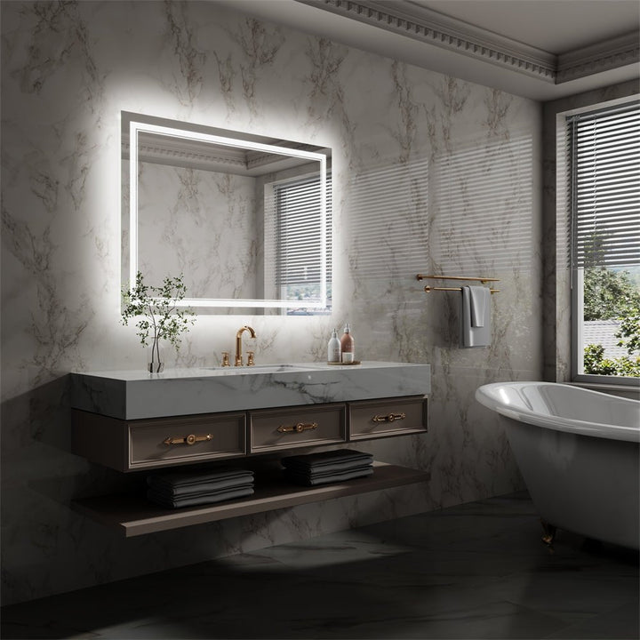 LED bathroom mirror with marble wall and modern floating vanity