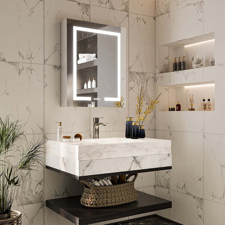 LED medicine cabinet with lighted mirror installed above marble vanity