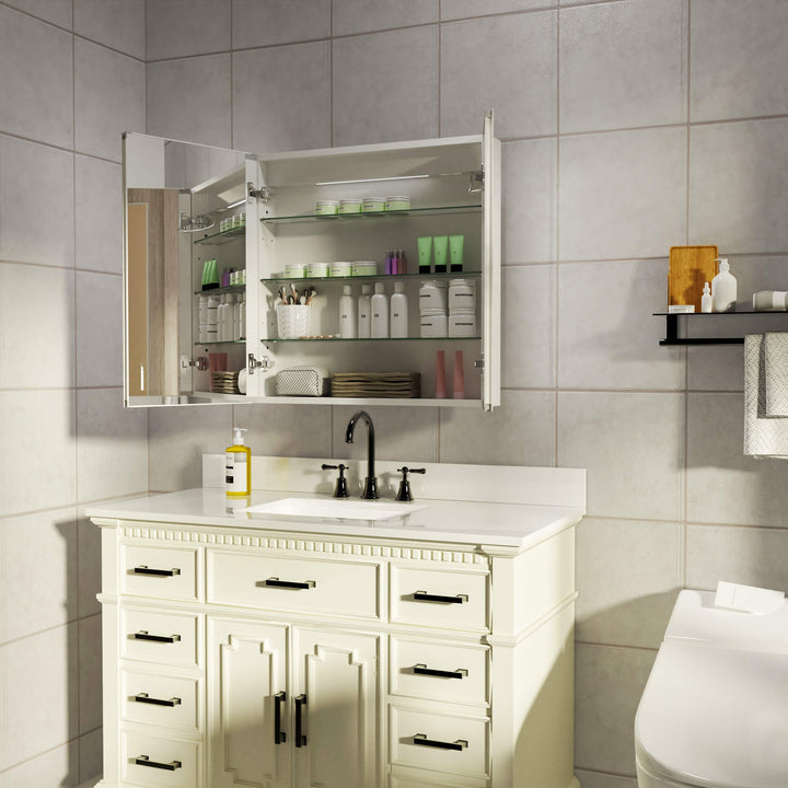 Lighted medicine cabinet with open doors displaying organized storage.