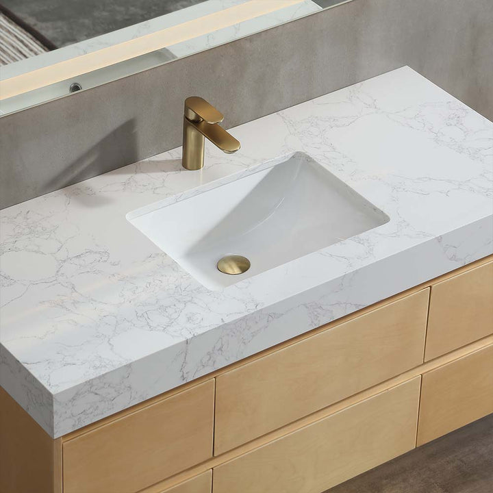 Bathroom vanity with marble countertop and ceramic basin