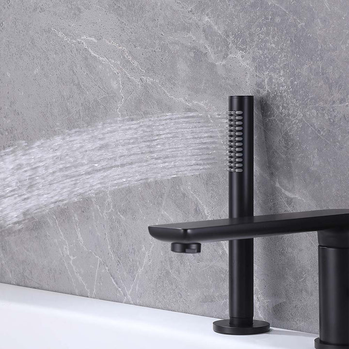 Matte black bathtub faucet with hand shower spraying water