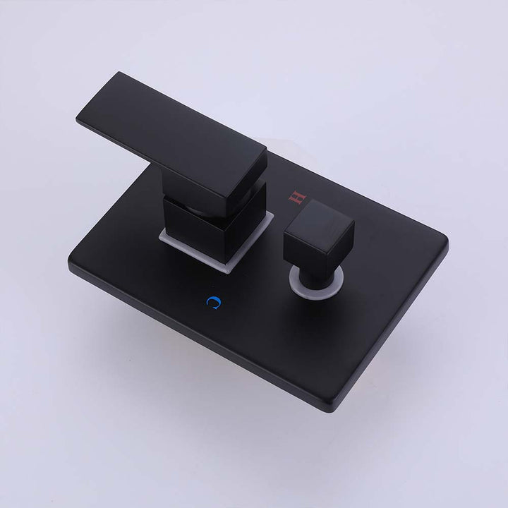 Close-up of matte black bathtub faucet valve and diverter