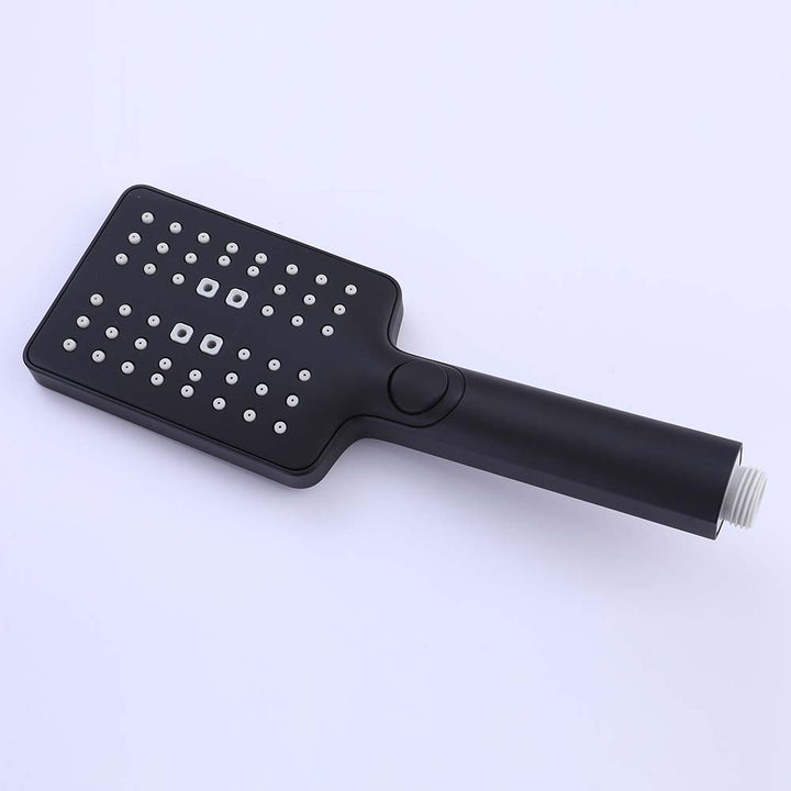 Close-up of matte black handheld shower head with spray nozzles