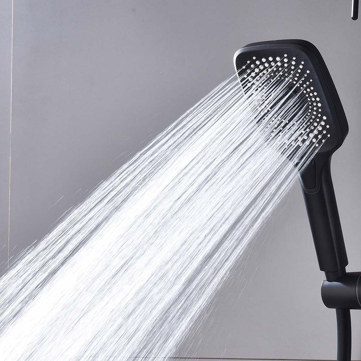 Matte black handheld shower head spraying high-pressure water stream.