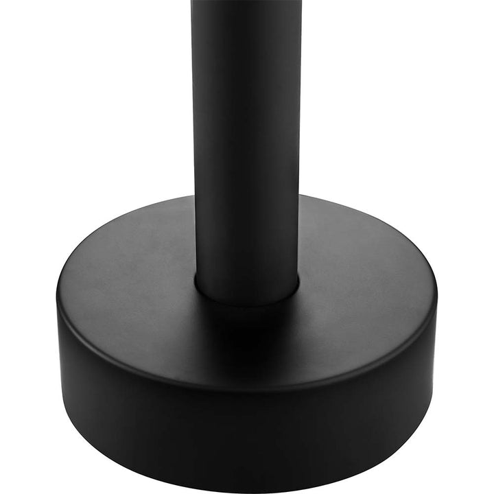 Matte black shower pole connected to round base