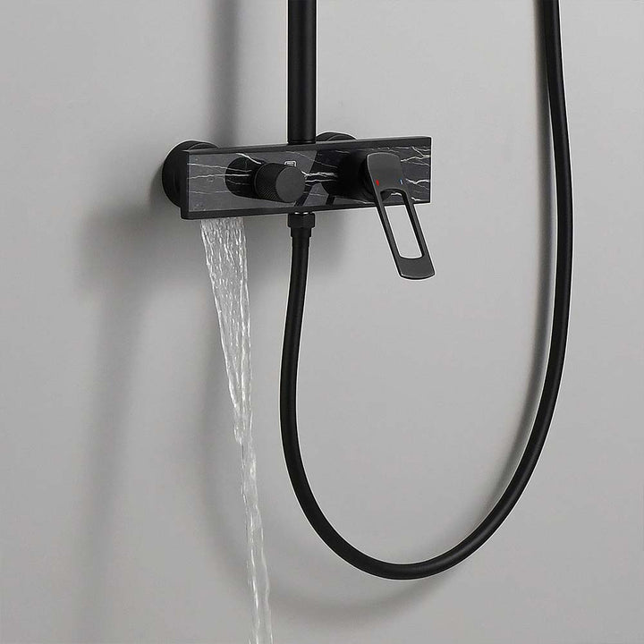 Matte black shower system with water flowing from tub spout.