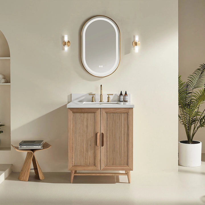 Front view of a 30 inch modern freestanding bathroom vanity with fluted doors, natural wood finish, and a white countertop with single sink.