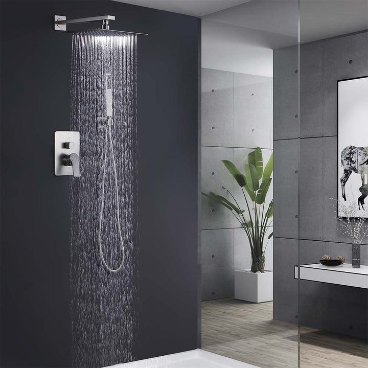 Modern bathroom brushed nickel shower system with rain head in use