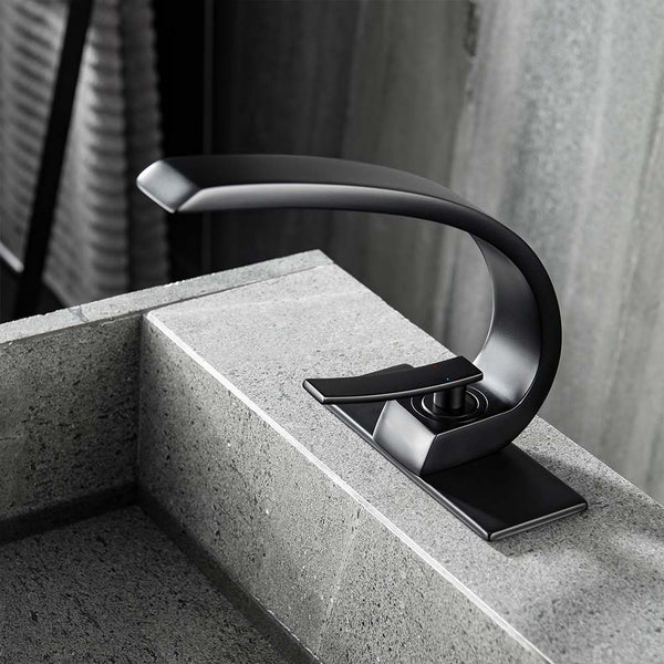 Modern black bathroom faucet on stone countertop