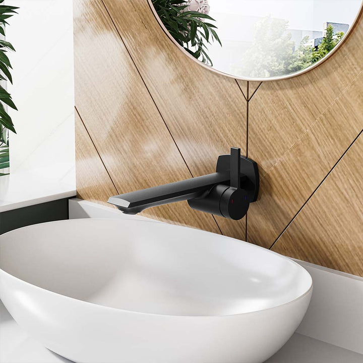 Modern black wall-mounted faucet with single handle above vessel sink.
