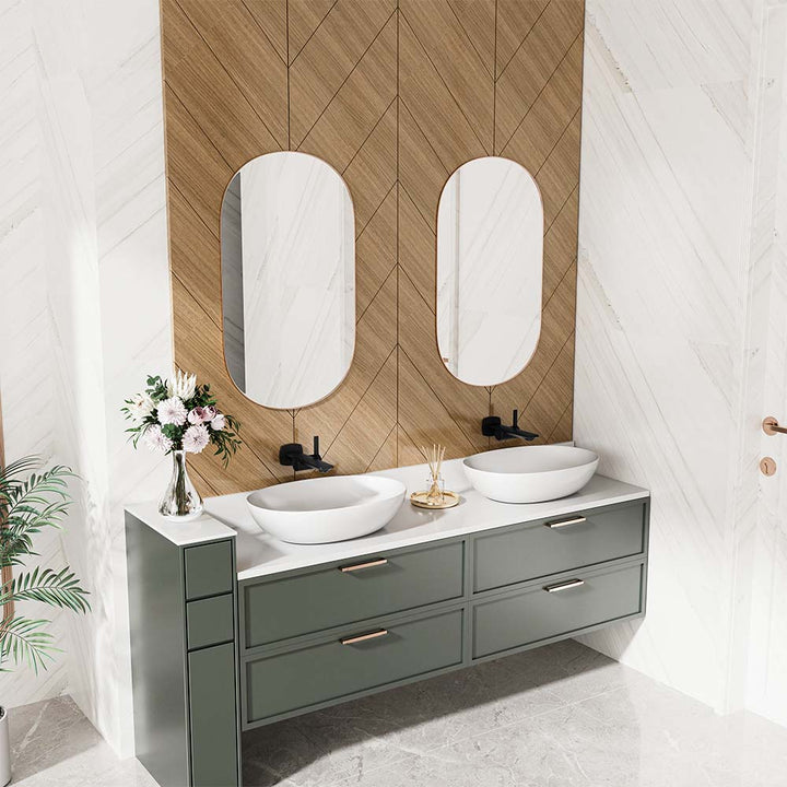 Double sink vanity with black wall-mount faucets and oval mirrors.