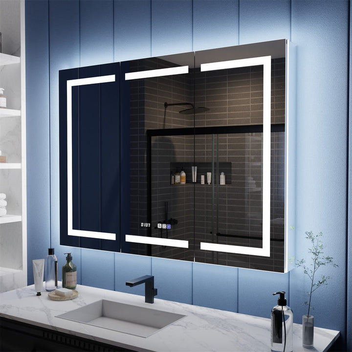 LED medicine cabinet with mirror on blue bathroom wall