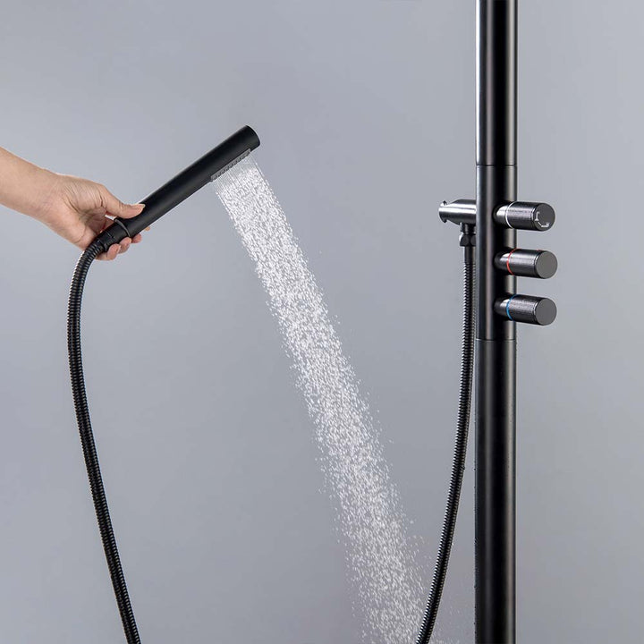 Black handheld shower spray and control knob in use