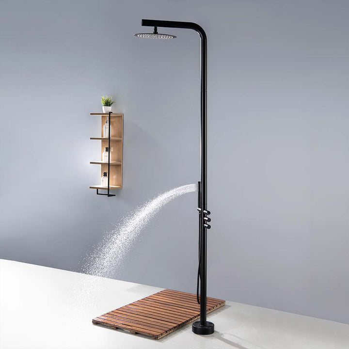 Black outdoor shower hand sprayer in use scene