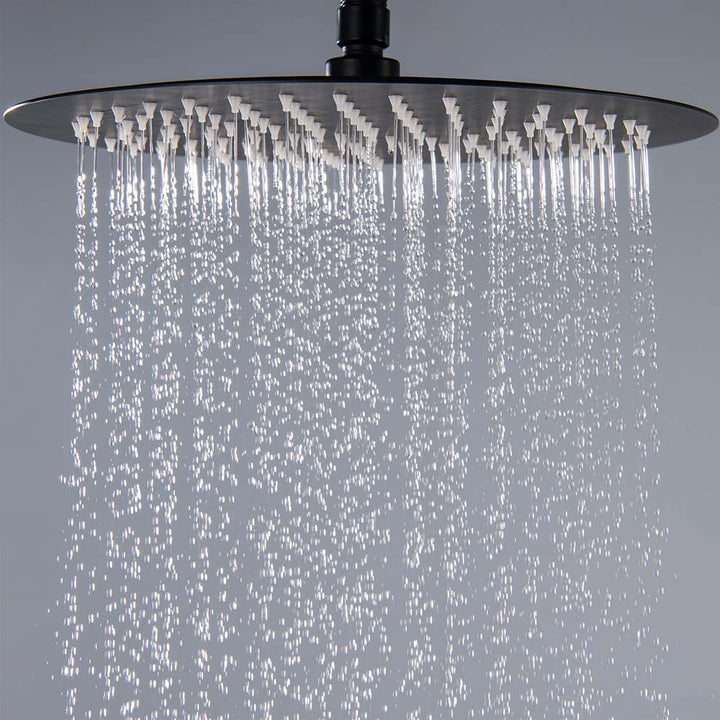 Close-up of rainfall spray from black outdoor showerhead