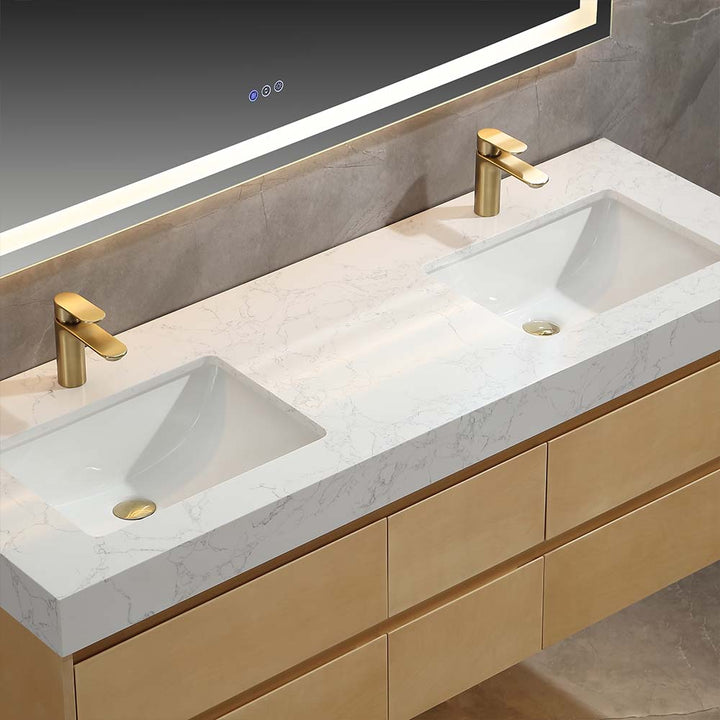 Modern vanity with dual sinks, marble countertop, and gold faucets