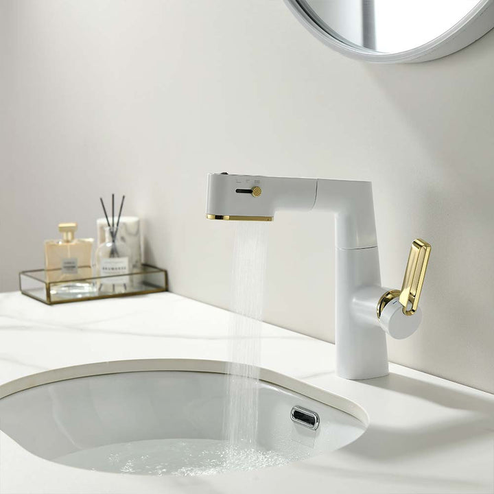 Modern white and gold bathroom faucet with flowing water in a minimalistic sink