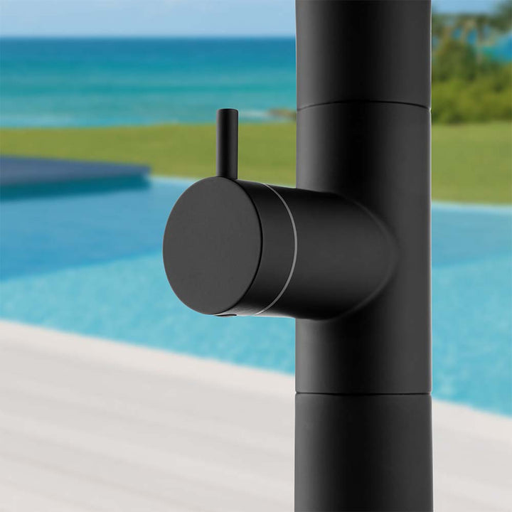 Close-up of black stainless steel outdoor shower control knob