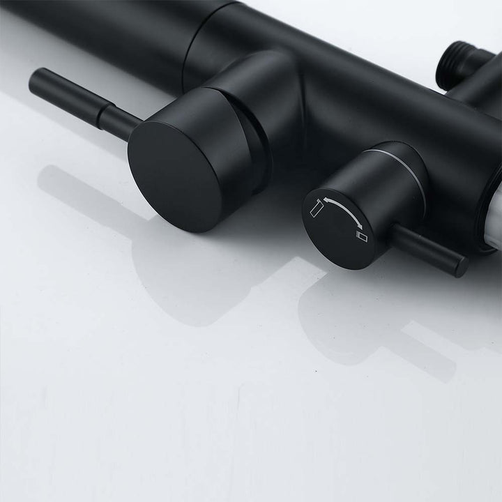Close-up of black outdoor shower system control handles