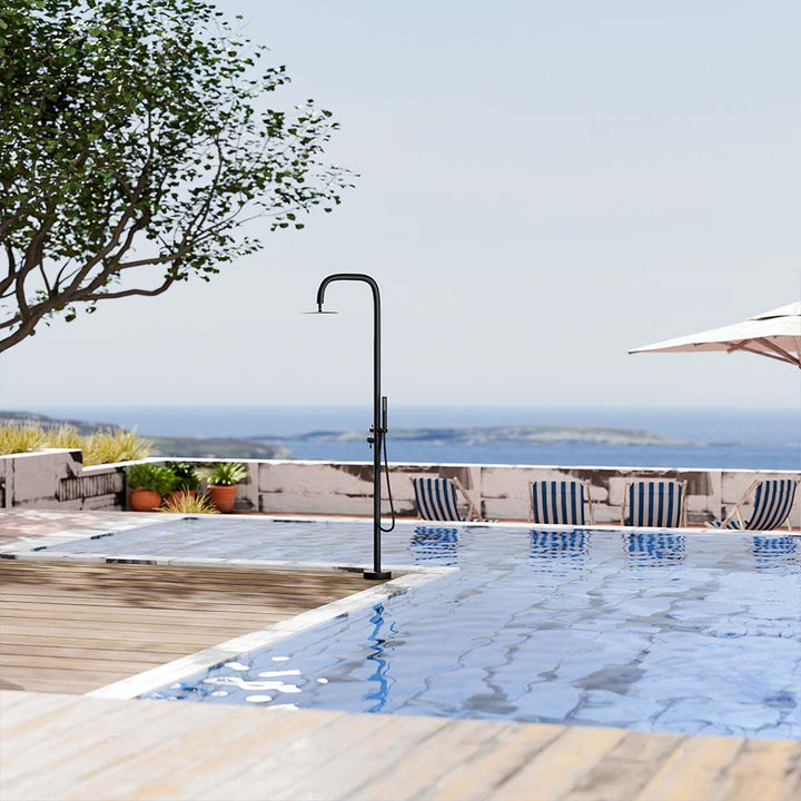 Black outdoor shower system by the swimming pool