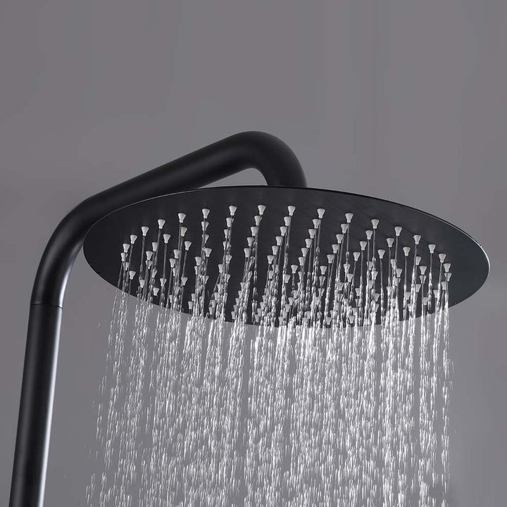 Outdoor black shower head spraying rainfall water