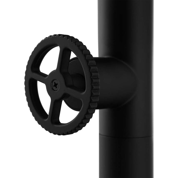 Side view of black control valve handle on outdoor shower pole