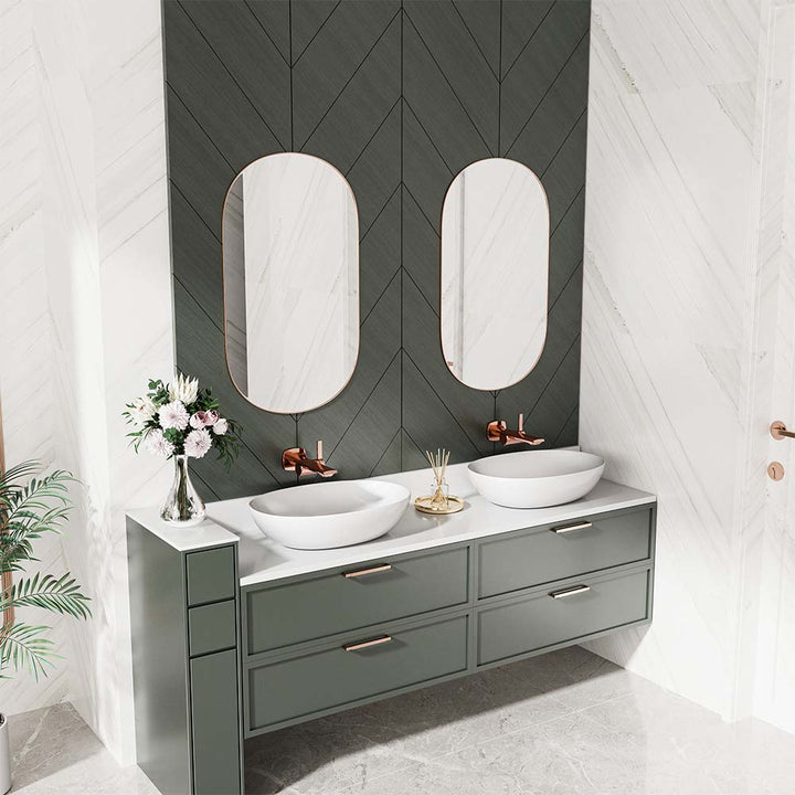 Rose gold faucets with dual sinks and vanity in modern bathroom.