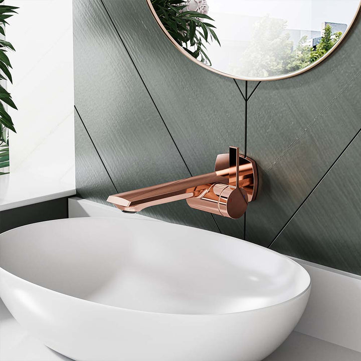 Side view of rose gold faucet and white vessel sink in bathroom.