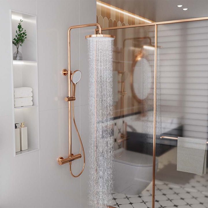 Rose gold shower system with rainfall shower head in modern bathroom