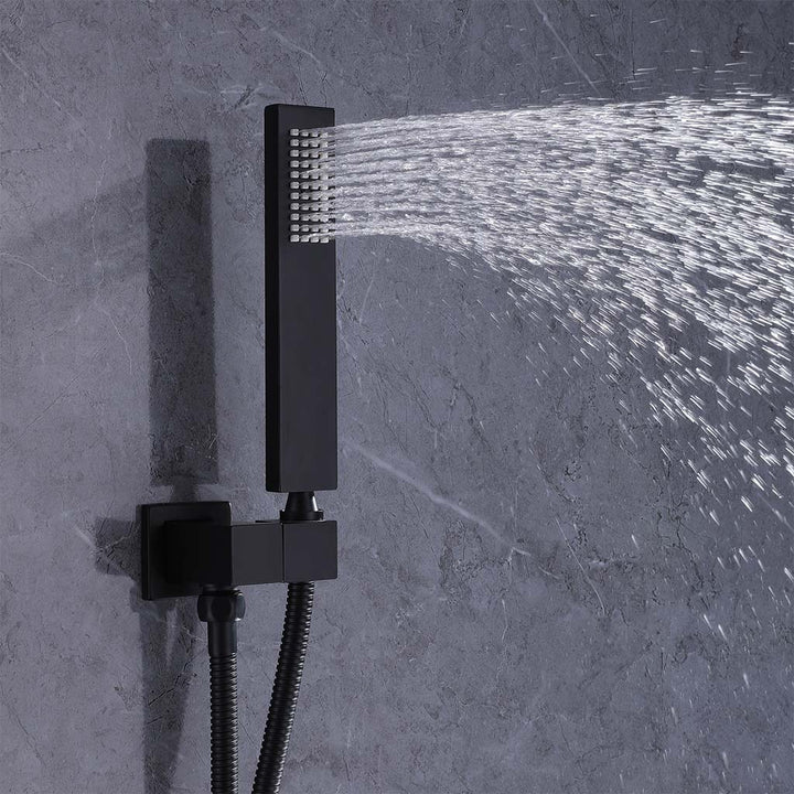 Black handheld shower system spray with water flow