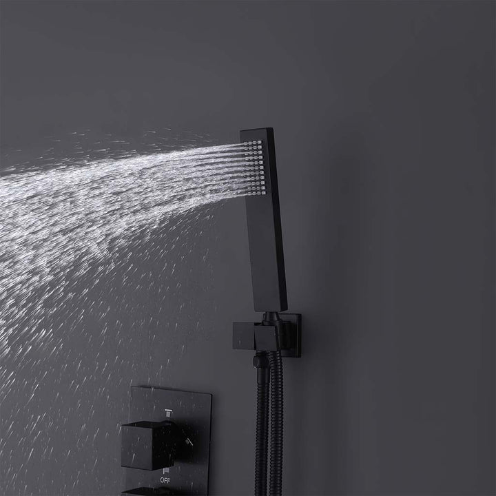 Black handheld shower spray in modern shower system