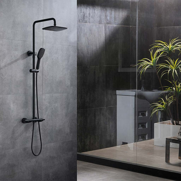Black wall mounted shower system with handheld sprayer and rain shower head