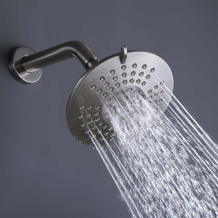 Brushed nickel shower system rain showerhead detail with water flow