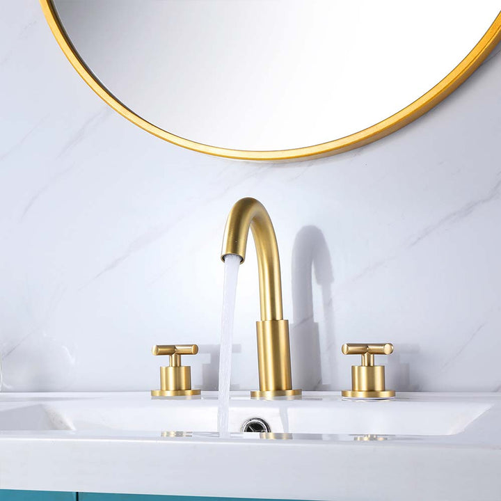 Gold bathroom faucet set with running water and vanity mirror