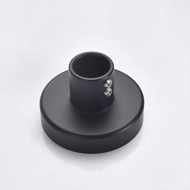 Matte black shower system wall mounting bracket with dual screws.