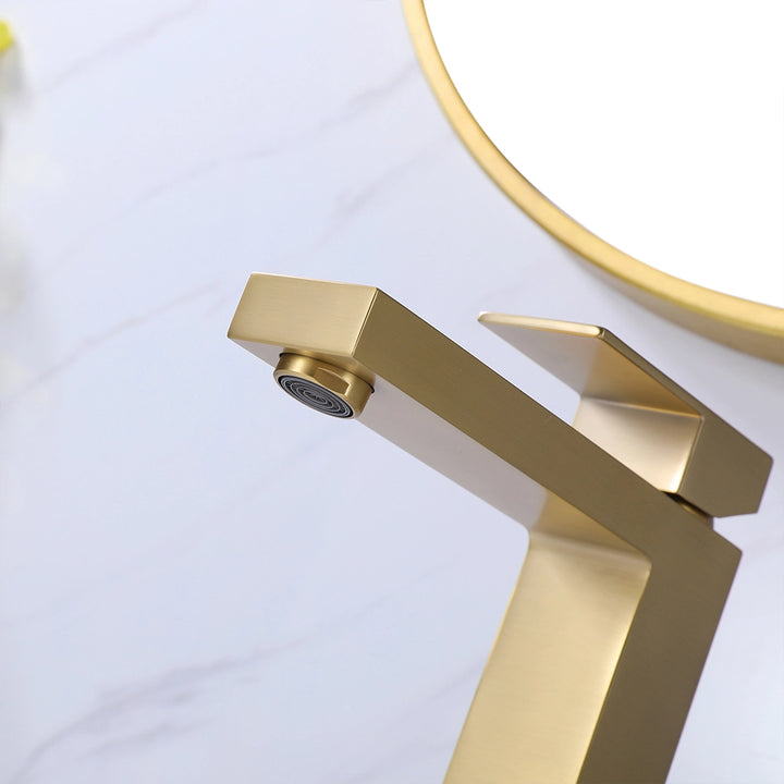 Brushed gold single hole bathroom faucet detail close-up