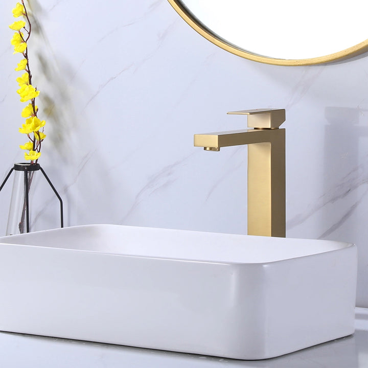 ALT: Modern gold single hole faucet beside ceramic sink