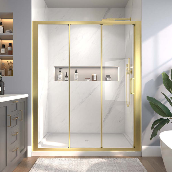 Gold-framed sliding shower door with built-in shelf and clear glass.