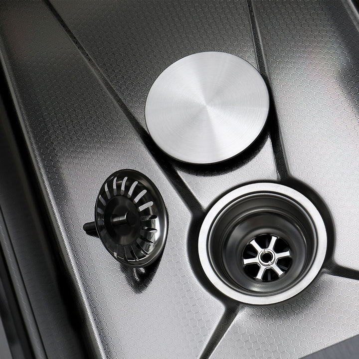 Close up of smart kitchen sink stainless steel drain and strainer